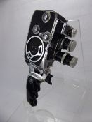 A Vintage Bolex Paillard B8L Cine Camera, some accessories, instruction manual in a leather carry