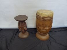 An African Tribal Wooden Carved Goats Skin Drum, carved with a mask, together with an African wood