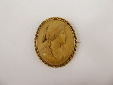 An Antique Agate Cameo Brooch, carved with a classical profile in relief, approx 4.5 x 4 cms, the