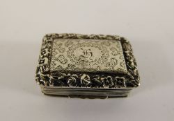 A Georgian Silver Vinaigrette, the vinaigrette having engraving to top with a repousse floral