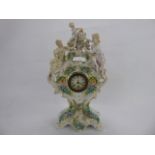 An Antique Meissen-Style Figural Mantel Clock, with delicate foliate decoration in relief and