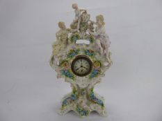 An Antique Meissen-Style Figural Mantel Clock, with delicate foliate decoration in relief and