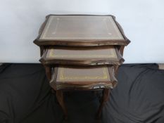 An Oak Nest of Tables, with leather tops under glass, the largest approx 55 x 42 x 53 cms, the