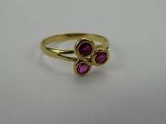 An 18 ct Yellow Gold and Ruby Ring, approx 1.5 gms, size Q, 3 x 3.25 mm rubies.