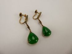 A Pair of Chinese 14 ct Yellow Gold Bright Green Jade Earrings, the earrings having character