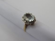 A Vintage 9 ct Yellow Gold Aquamarine and Diamond Ring, aqua 10.8 mm approx 12 pts of dias, size