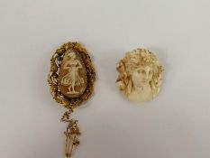 An Antique Ivory Brooch, carved in relief together with a yellow metal filigree shell cameo of a