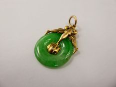 A Chinese 9 ct Yellow Gold and Bright Green Jade Pendant, the pendant having fine engraving with