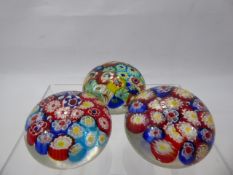 Three Millefiori Paperweights, colourful canes, approx 6 x 4 cms