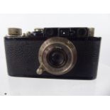 An Ernst Leitz Leica I (C) Wetzlar D.R.P Camera, nr 106917, black body with Leitz Elmar 1:35 F 50 mm