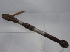 An African Wood-Carved Tribal Axe with wire decoration to the handle, approx 46 cms.