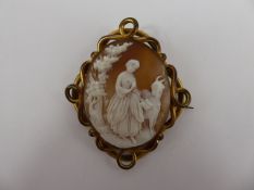 An Antique Shell Cameo Brooch, carved with a girl and goat, approx 4.5 x 4 cms, contained within a