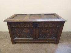 An 18th Century Oak Panelled Coffer, with decorative foliate carving to front, approx 105 x 52 x