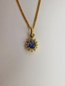 An 18ct Yellow Gold Sapphire and Diamond pendant on 18ct gold chain approx 2.6 gms, the pendant