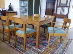 A Gordon Russell Oak 'Weston' Dining Room Suite, comprising: a set of four standard dining chairs