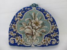 A Victorian Beaded Tea Cosy, depicting flowers.