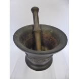 An Early 18th Century English Bronze Apothecary Pestle and Mortar, the waist applied with shell