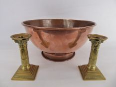 A Large Victorian Copper Mixing Bowl approx 38 cms dia, together with two brass candle sticks,