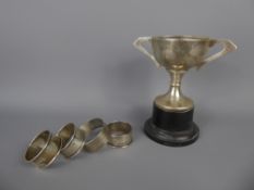 A Silver Trophy Cup, together with four silver napkin rings, all Birmingham hallmark, various date