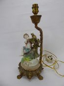 An Antique Continental Figural Gilt Brass Lamp Base, depicting a small boy playing the flute, approx