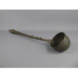 An Antique Pewter Ladle, incised with foliate decoration, possibly Ottoman, approx 55 cms.