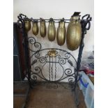 An Oriental Glockenspiel with six graduated bells on a wrought iron stand, approx 84 cms high.