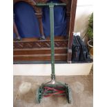 A Vintage 'British Flexa' Lawn Mower with wooden handle.