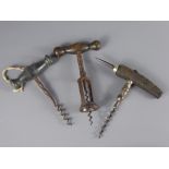 Three Vintage Corkscrews, two with wooden handles and the other with horn.