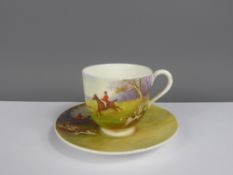 A Royal Worcester Demitasse & Saucer, hand painted with hunting scenes, signed Albert Shuck.