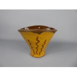 A Winchcombe Pottery Earthenware yellow and brown-decorated glazed oval wall vase, unidentified,