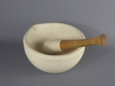 A Stone Pestle and Mortar, approx 11 x 21 dia. cms.