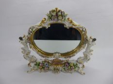 An Antique Italian Capodimonte Naples Dressing Table Mirror, embellished with gilded floral spray,