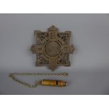 A Victorian Cast Iron Commemorative Trivet together with a circa 1907 brass whistle on brass lanyard