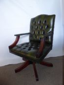 A Contemporary Chesterfield Green Leather Captain's Chair, (height can be adjusted).