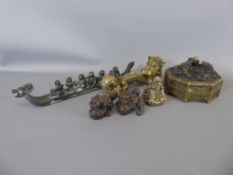 A Chinese Brass Scroll Weight, approx 21 cms together with a dragon boat with figures, approx 34