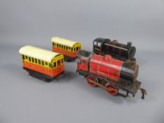 A Vintage 'O' Gauge Train Set, comprising of locomotive, coaches, station platform, transformer