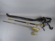 A Naval Officers Dress Sword and Scabbard, dated 1966, the sword features a gold-plated brass