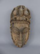 A West African Tribal Mask, with decorative headdress depicting bottle gourd, horns and tongs,