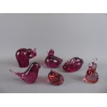 A Quantity of Wedgwood Cranberry Glass Animals, including an elephant, two rabbits, a frog, bird and