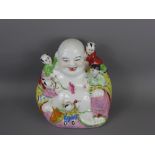 A Vintage Chinese Laughing Porcelain Buddha surrounded by five children, marks to base, approx 22