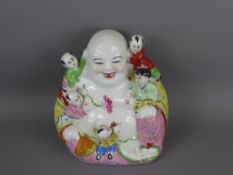 A Vintage Chinese Laughing Porcelain Buddha surrounded by five children, marks to base, approx 22