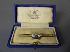 A 9 ct Gold and Enamel Coronet Brooch in Mappin & Webb Box, the box approx 5 cms, approx 3.6 gms.