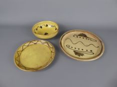 Three Winchcombe Pottery earthenware items (1960's), including two yellow and brown-decorated glazed