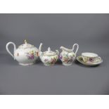 A Floral Dresden Part Tea Set, comprising tea pot, sugar bowl, milk jug, six saucers and one cup.