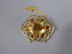 A 9ct Yellow Gold and Citrine Brooch, the centre stone measuring approx 17 x 12 mm and surrounded by