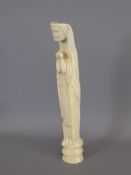 An Antique Carved Ivory Figure of 'The Madonna' praying, approx 29 cms.