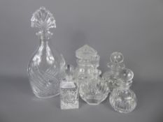 Miscellaneous Cut Glass, including a four scent bottles, a cotton wool jar and a water decanter. (
