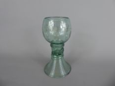 An Antique Wine Glass, ribbed stem with vine engraving, approx 13 cms.