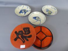 Three Chinese Ceramic Fish Plates, together with a red lacquer hors d' oeuvre tray and dishes.