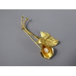 An 18ct Yellow Gold and Baroque Pearl Lily Brooch, approx 6.5 cms and 6 gms.